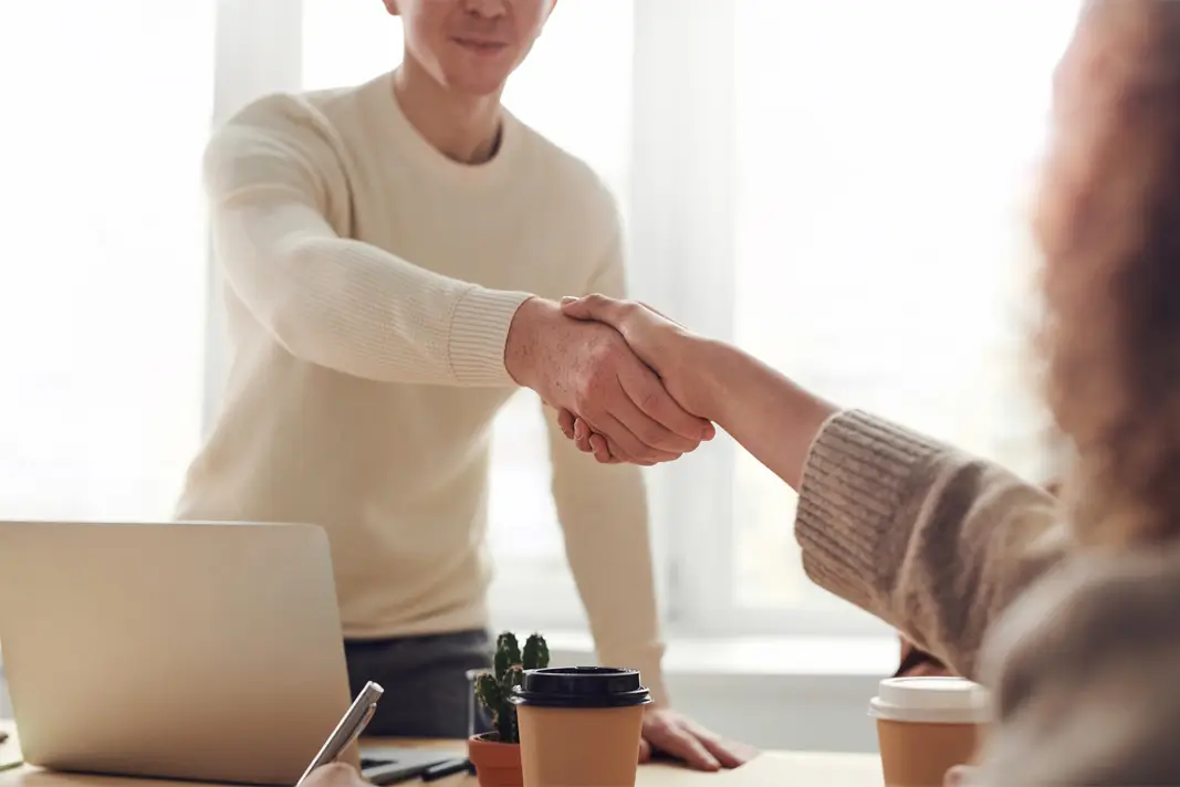 Woman Shaking hands with man